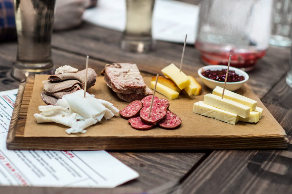 Charcuterie board with meats and cheeses