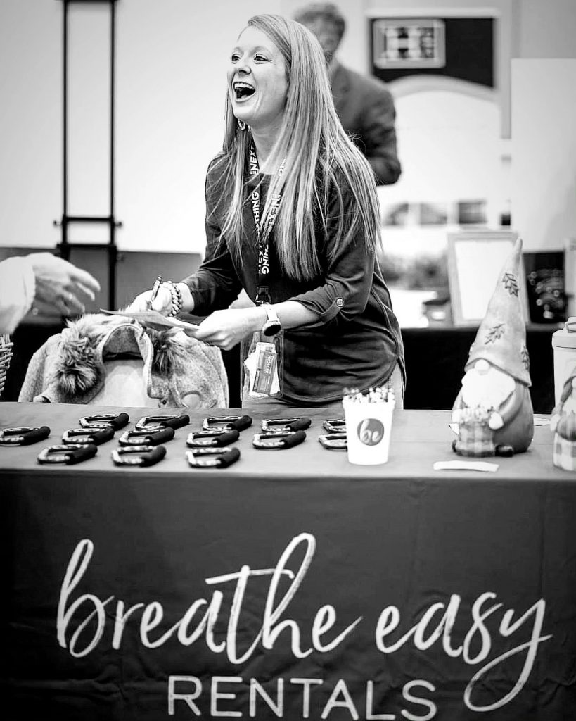 Breathe Easy Rentals' owner, Brittany Blackman, at a conference booth at The Next Big Thing